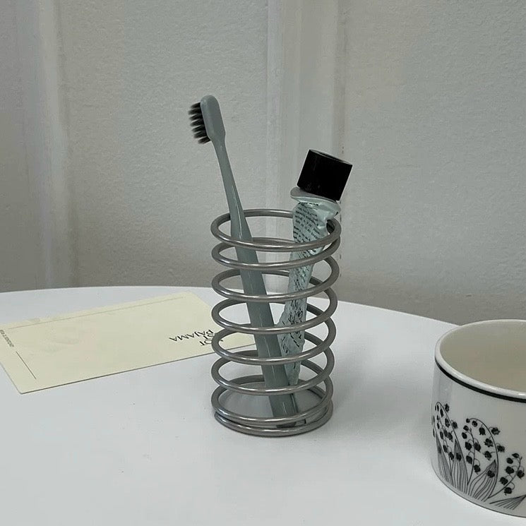 Spring brush stand